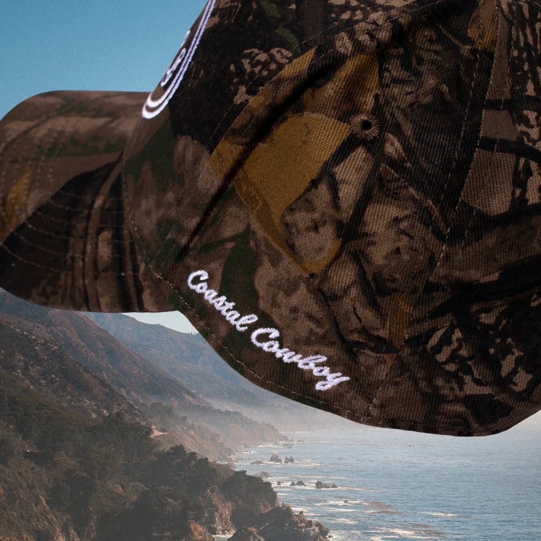Cowgirl themed camo trucker hat
