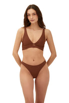 Knotted top with adjustable straps and a tie back in brown