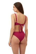 Raspberry red bottom with a mid rise fit and medium coverage