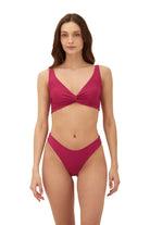 Raspberry red bottom with a mid rise fit and medium coverage
