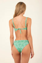 Underwire top with adjustable straps and a tie bak in green with palm tree print