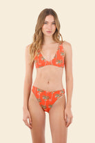 Modest coverage orange bikini bottom with palm tree print