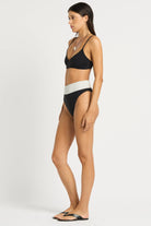 High waist bikini bottom that reverses from black to white