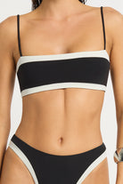 Spaghetti strap bandeau top that reverses from black to white