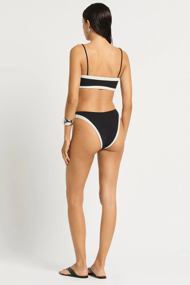 Spaghetti strap bandeau top that reverses from black to white