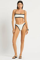 Spaghetti strap bandeau top that reverses from black to white