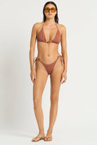 Shimmery brown triangle top with decorative ring in the front