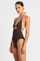 One size one piece with an open back, front cutout, and adjustable triangle cups in Chocolate Brown.