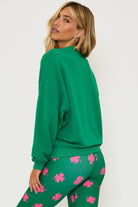 Green cotton sweatshirt with pink shamrock and lettering
