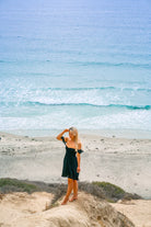 Short black dress with ruffled short sleeves