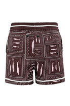 Boys swim trunks in brown wih white print