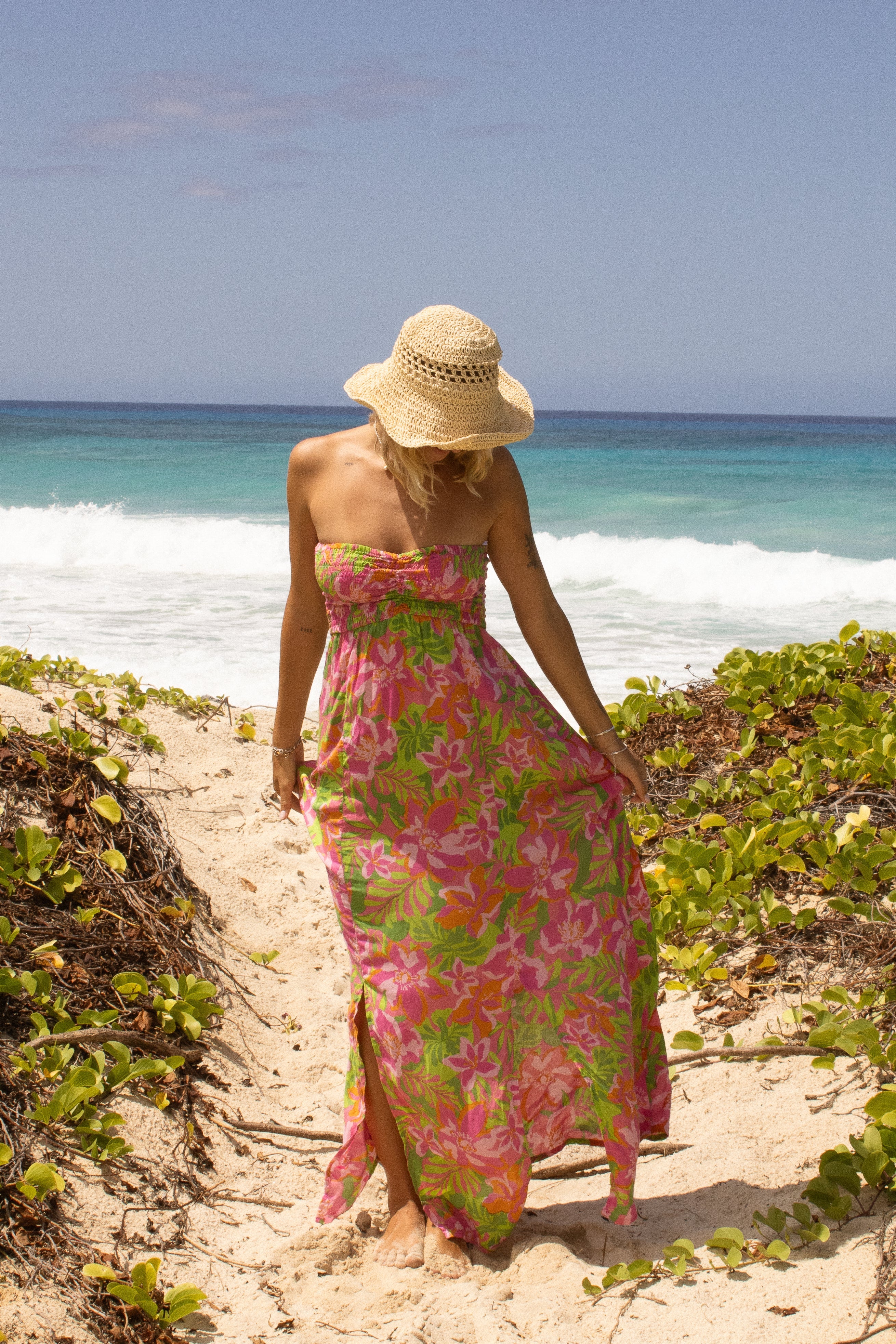 Sleeveless maxi dress with smocking on top in a bright tropical print
