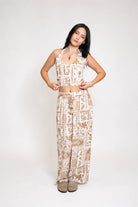 Cropped top with halter neckline in brown print