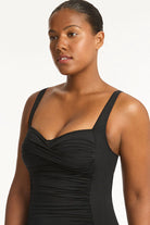 Full coverage black one piece with soft cup support and boyshort coverage in the back