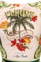 Tropical themed high neck swimsuit with floral and palm tree design 