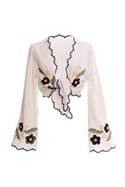White top with long bell sleeves and blue and yellow floral embroidery