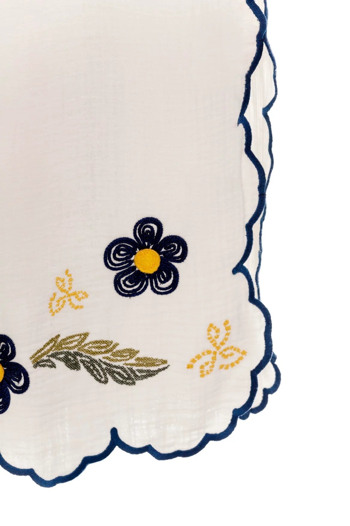 White wide leg pants with elastic waistband and blue and yellow embroidered floral print