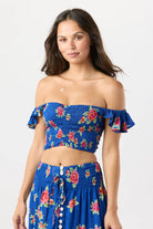 Smocked crop top with ruffled sleeves in blue with floral print