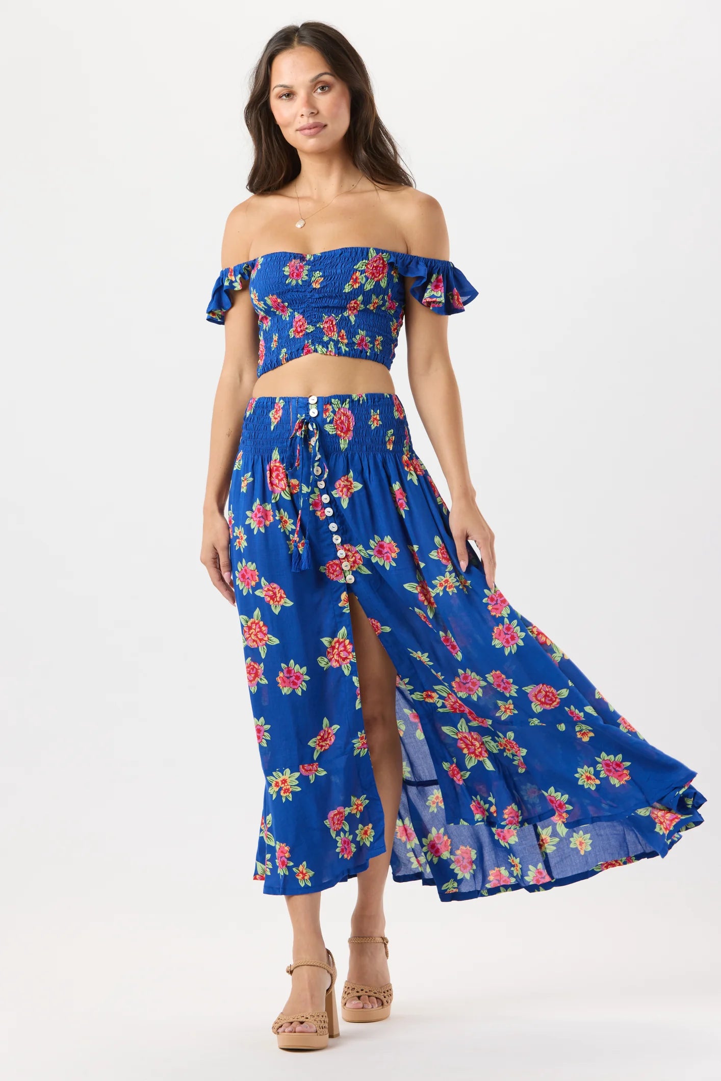 Smocked crop top with ruffled sleeves in blue with floral print