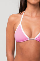 Adjustable triangle bikini top in pink with white trim
