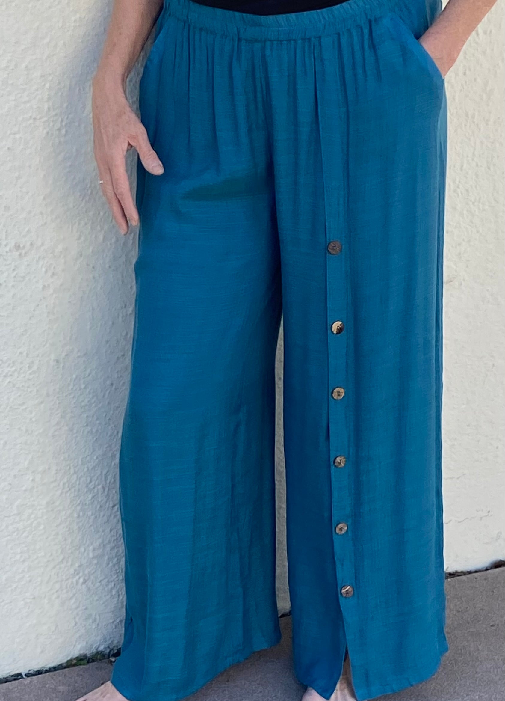 Wide leg pants with buttons down the left side in Teal