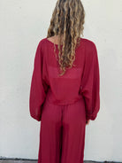 Flowy red pants with buttons down the left side