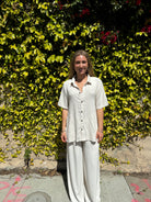 Bamboo pants with decorative buttons down each side in Cream.