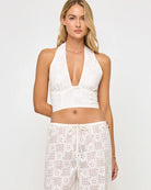 Cropped halter top with a deep plunging neckline in Cream