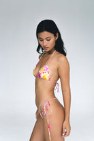 Skimpy bikini bottom with a single tie side in colorful print