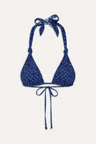 Adjustable triangle top with knotted halter ties  that reverses from gingham to star print