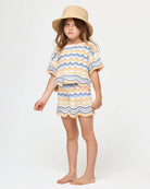 Girls' top and shorts set with scalloped hem in wavy multicolor stripes