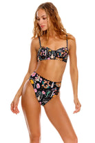 Black underwire top with scalloped edging and colorful print