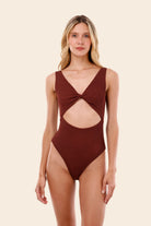 Textured one piece with front and back cutouts and a tie back