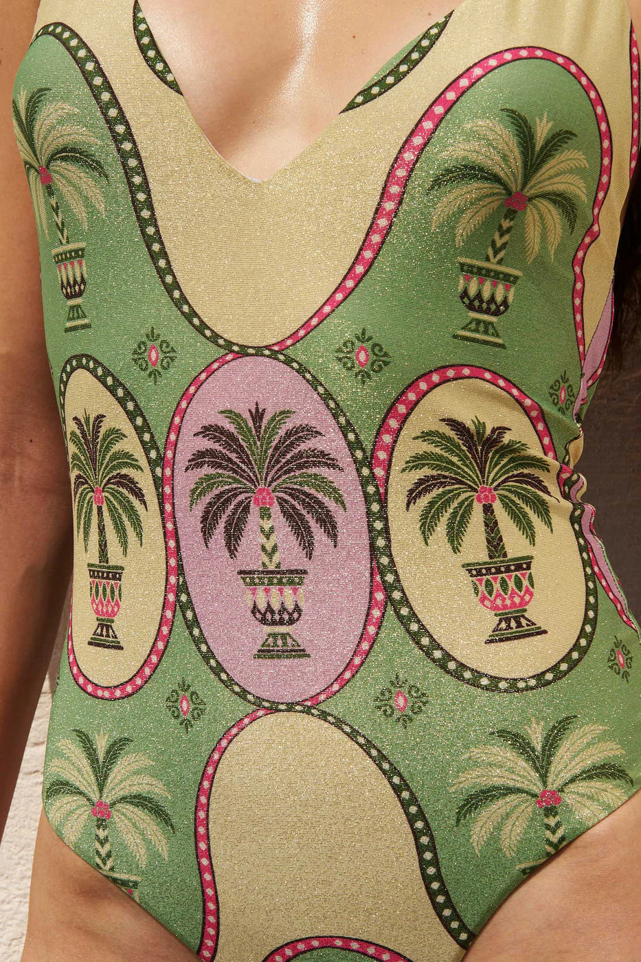Shimmery palm print one piece with plunging neckline