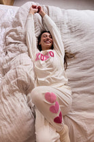 Sweatpants with hearts down the left side in cream