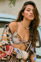 Knot front top with removable straps and a tie back