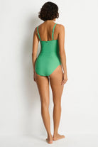 Green textured one piece with a u bar in front and removable straps