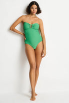 Green textured one piece with a u bar in front and removable straps