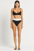 High waist bikini bottom that reverses from black to white