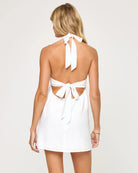 V-neck sleeveless mini dress with halter tie behind the neck in Cream