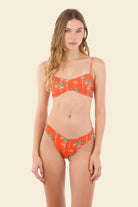 Orange bandeau bikini top with palm tree print