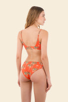 Orange bandeau bikini top with palm tree print
