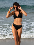 Black triangle bikini top with thick halter ties and lattice detail under the bust