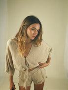 Textured top with plunging neckline and tie front