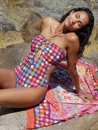 Plunging one piece with ring detail and a low back in colorful print