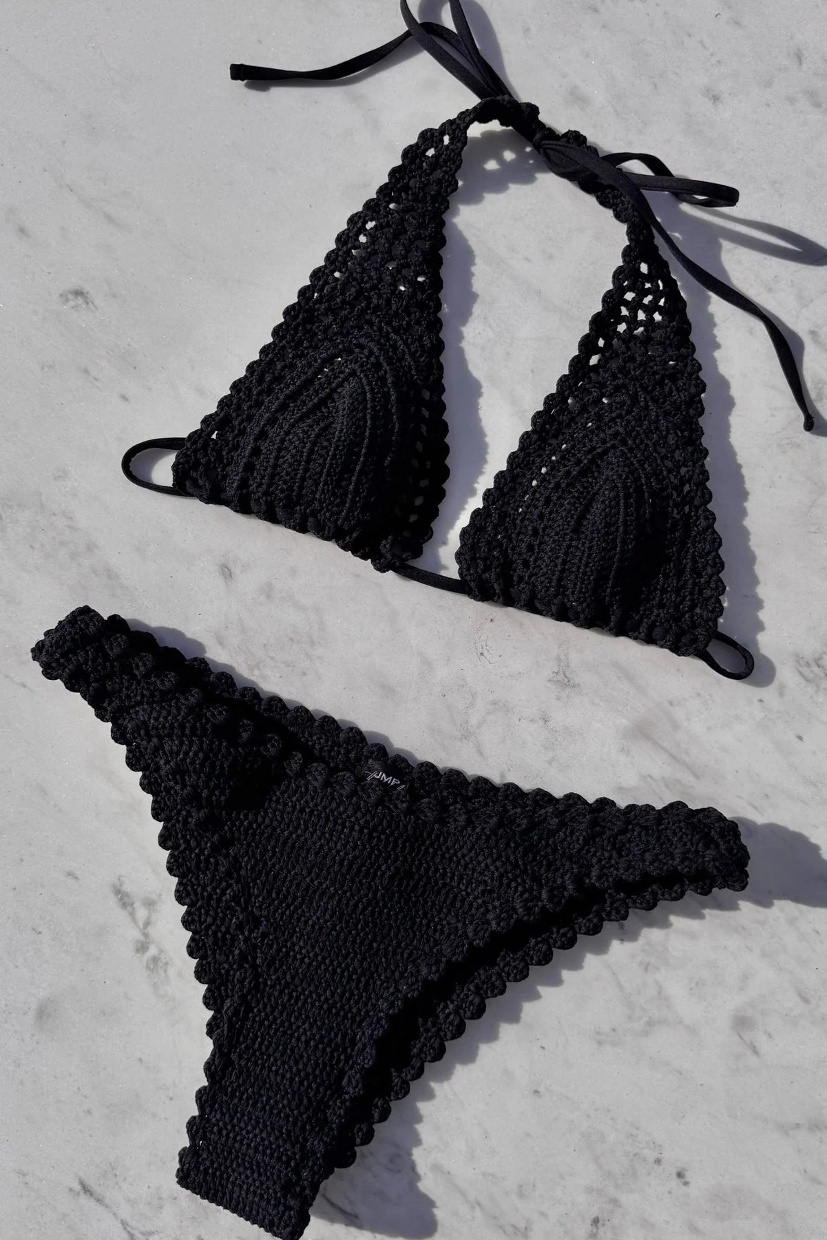 Hand crocheted plunging halter bikini top in black
