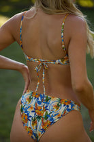 Underwire top with a scooped neckline and adjustable straps in multicolor print