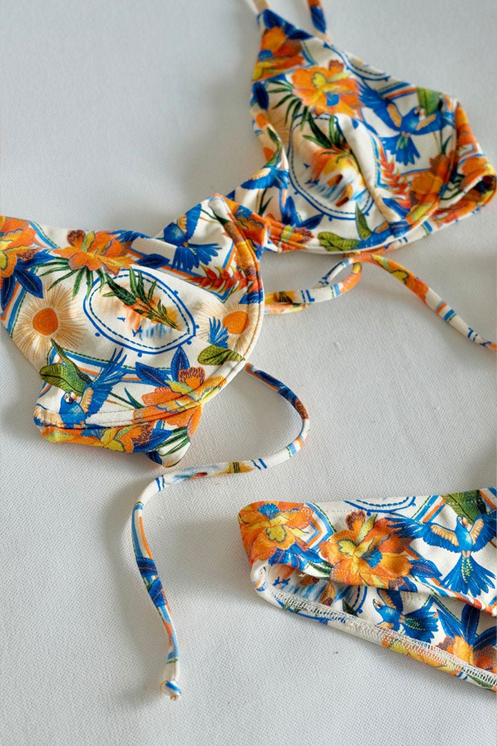 Underwire top with a scooped neckline and adjustable straps in multicolor print