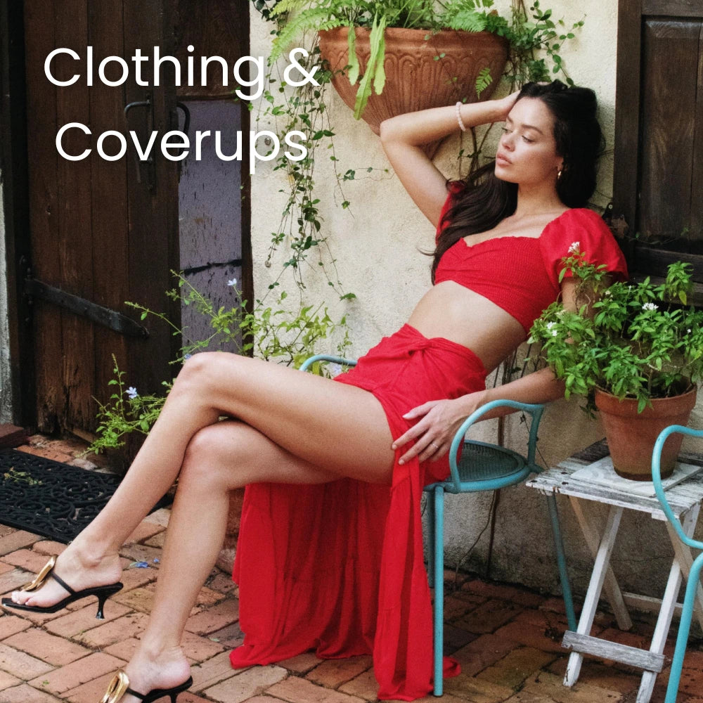 Model reclining in a chair wearing a vibrant red coverup and swimwear ensemble, perfectly blending relaxation with style for the Clothing & Coverups collection.