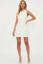 Short ivory dress with gold buttons